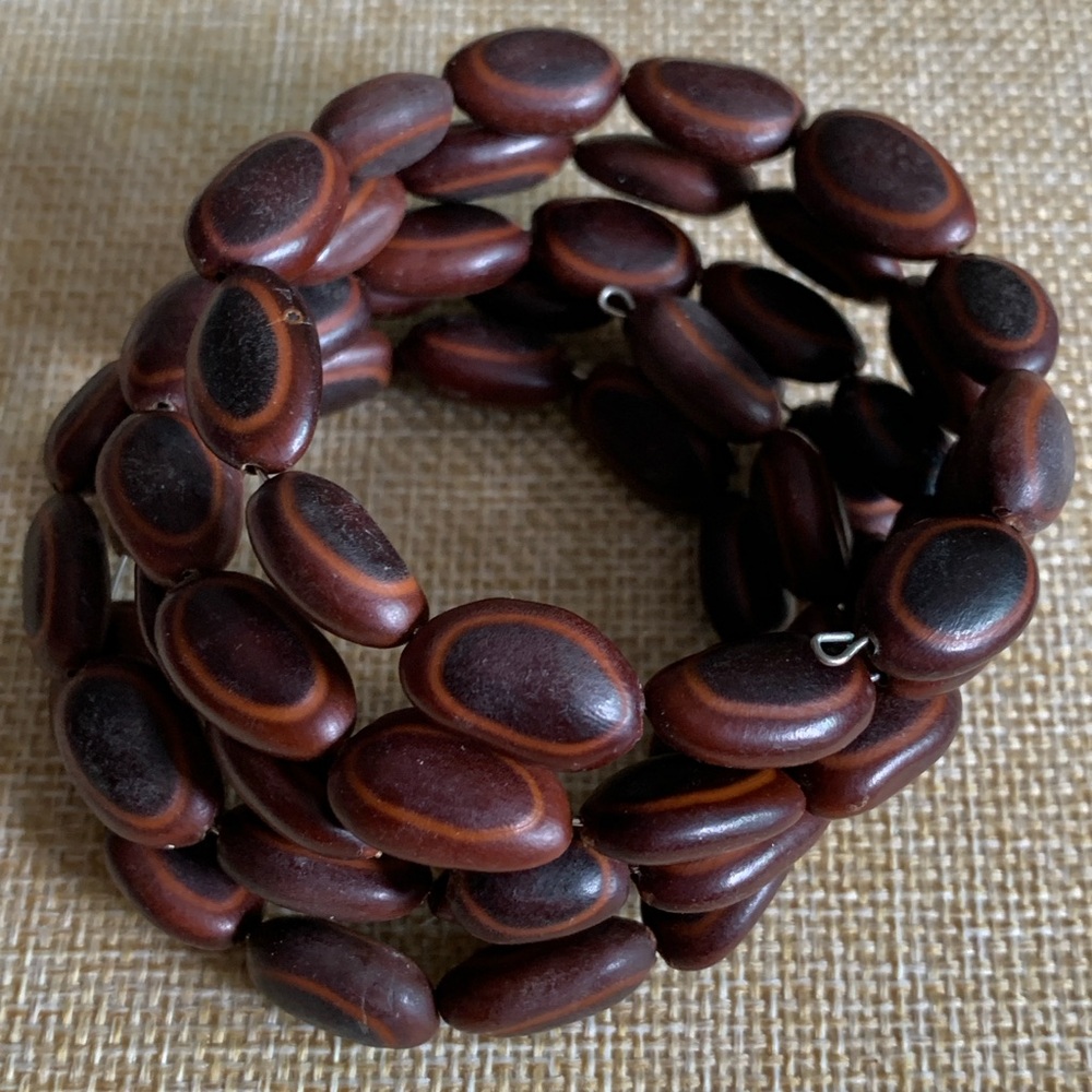 Vintage seed bead snake bracelet with memory wire structure.